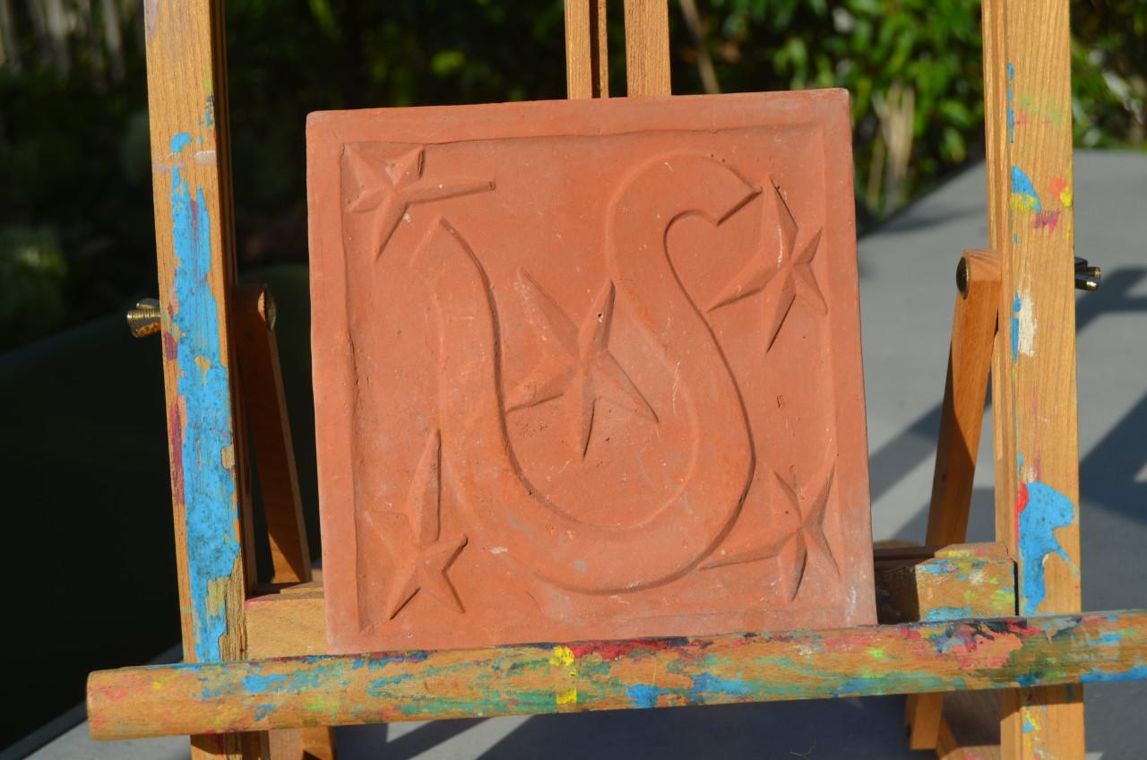 Verschillende terracotta tegels Sterrenbeelden/ Zodiac