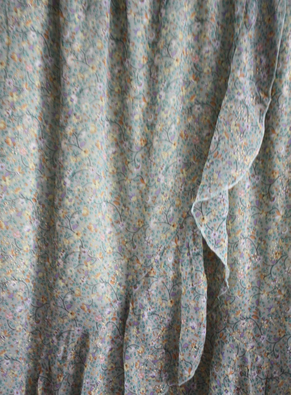 Licht groene rok met bloemen en goedkleur details  maat m