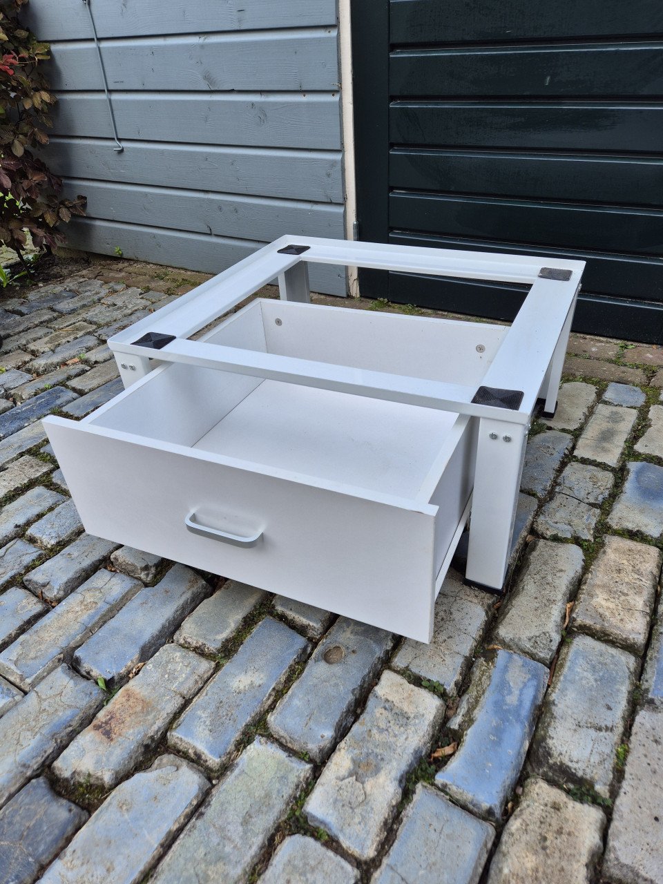 Wasmachine of droger verhoger