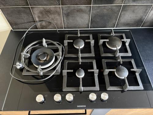 Siemens 5-pits gaskookplaat met wokbrander – zwart glas