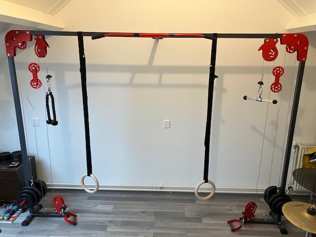 Cable cross fitness machine