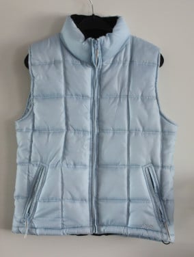 Licht blauwe bodywarmer maat s