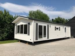 TE KOOP GEVRAAGD CHALET MET VASTE STAANPLAATS ZEEUWS VLAANDEREN