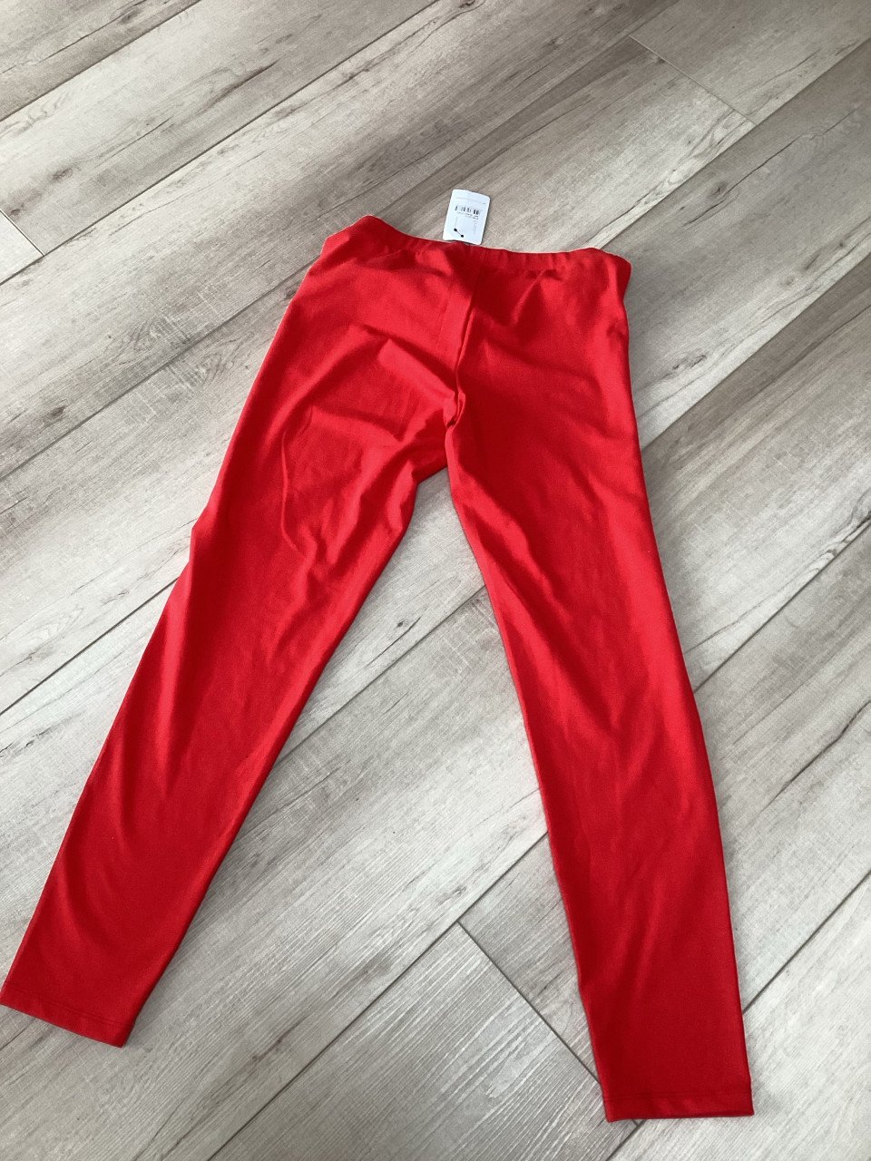 Nieuwe rode legging met kaartje er nog aan maat L