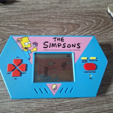 Vintage Acclaim The Simpsons  Handheld Video Game