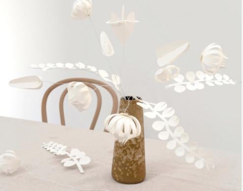 Pakket met 12 witte papieren bloemen om zelf in elkaar te zetten