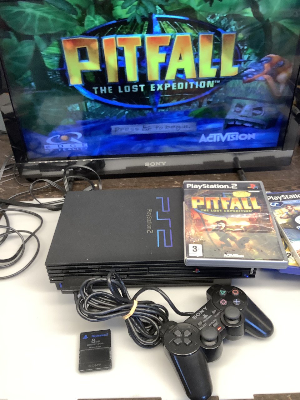 PlayStation 2 met 1 controller en 3 spellen GTA 4 + Pitfall.