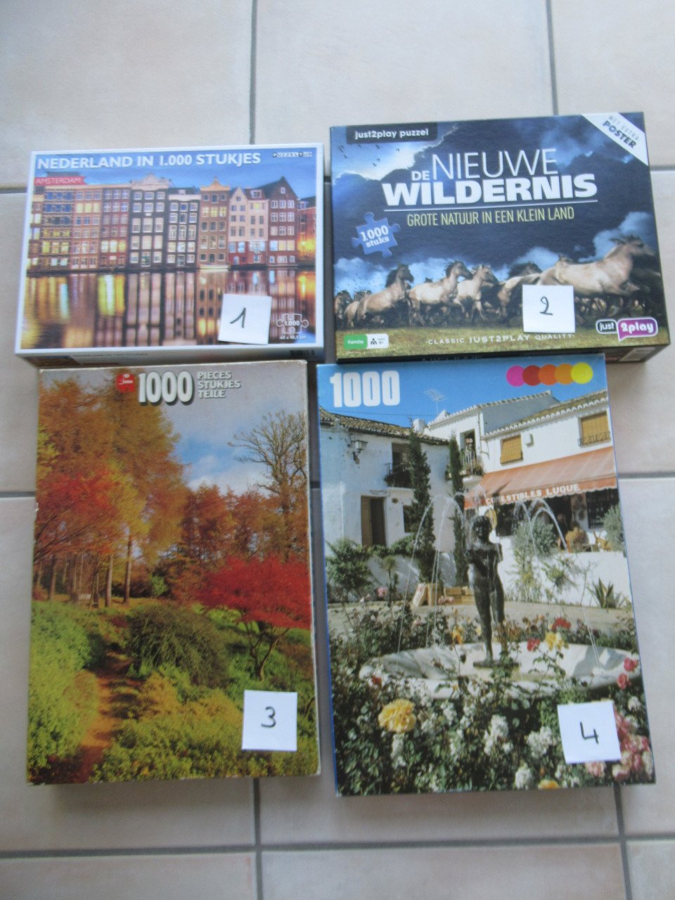 4 leuke volledige puzzels van 1000 stukjes, zo goed als nieuw