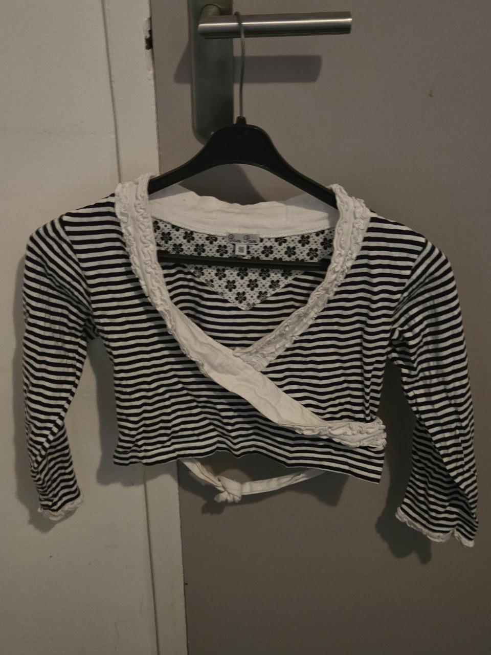 Zwart-wit gestreept overslagshirt met lange mouwen maat 122/128 Pom Pom