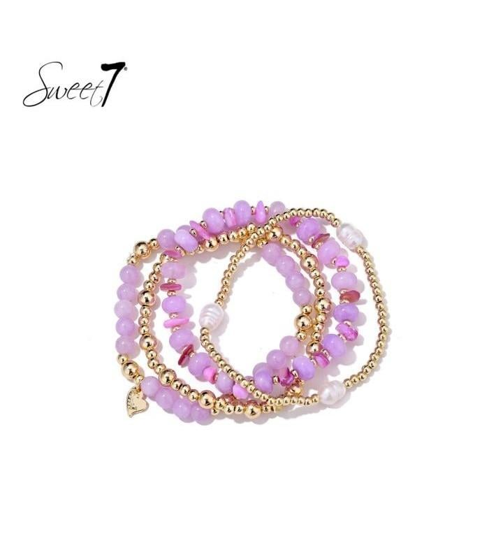 Armband met roze en paarse kralen in trendy stijl