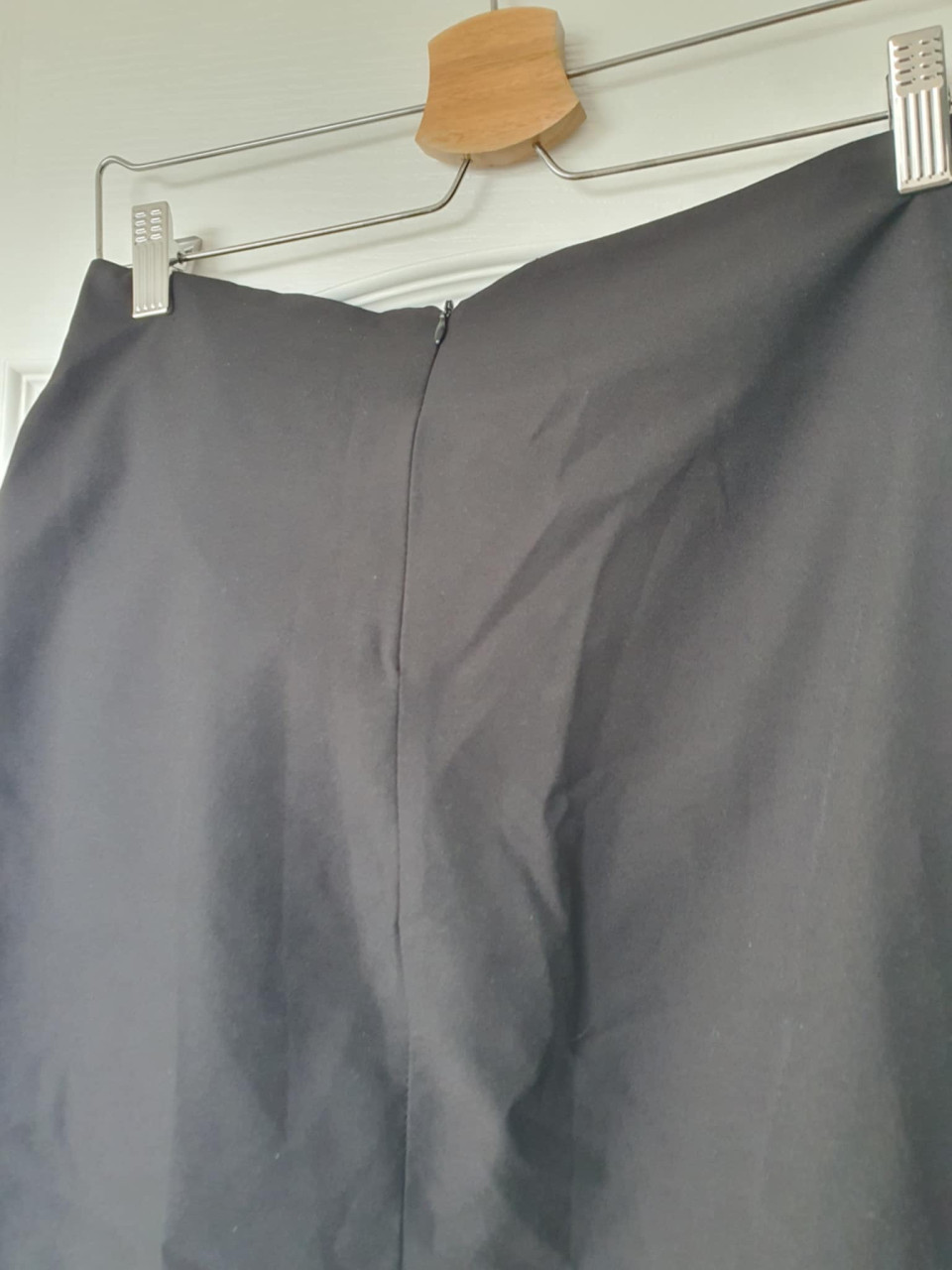Kort zwart rokje met strik maat S