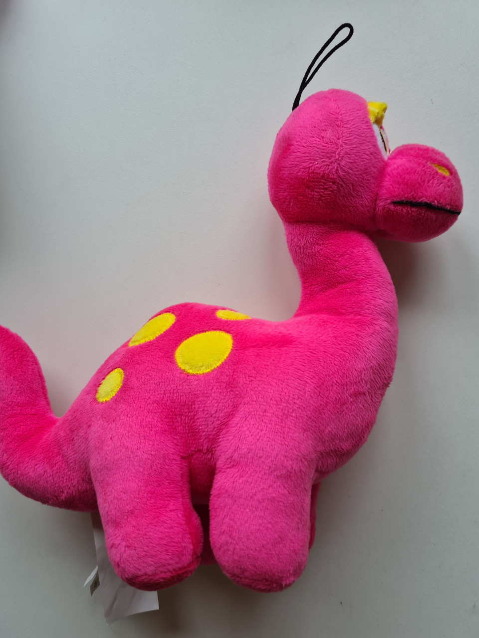 Schattige roze dinosaurus knuffel