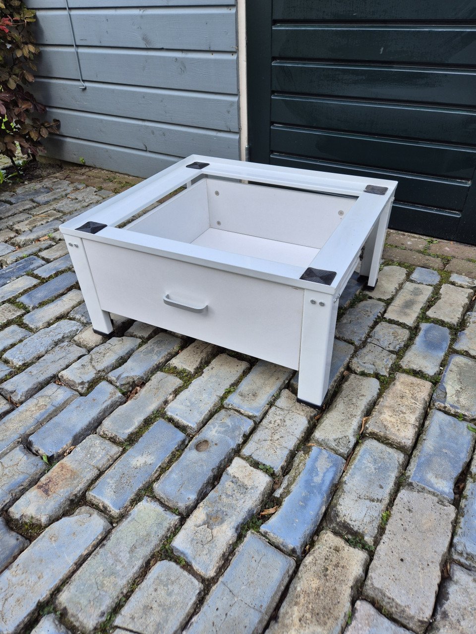 Wasmachine of droger verhoger