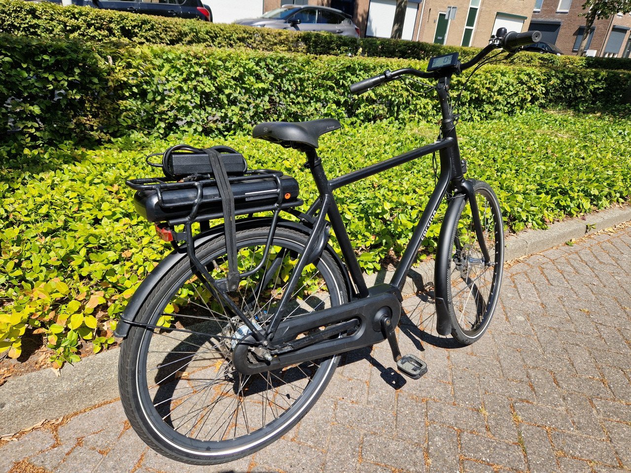Keurig nette Cortina elektrische heren fiets met middenmotor