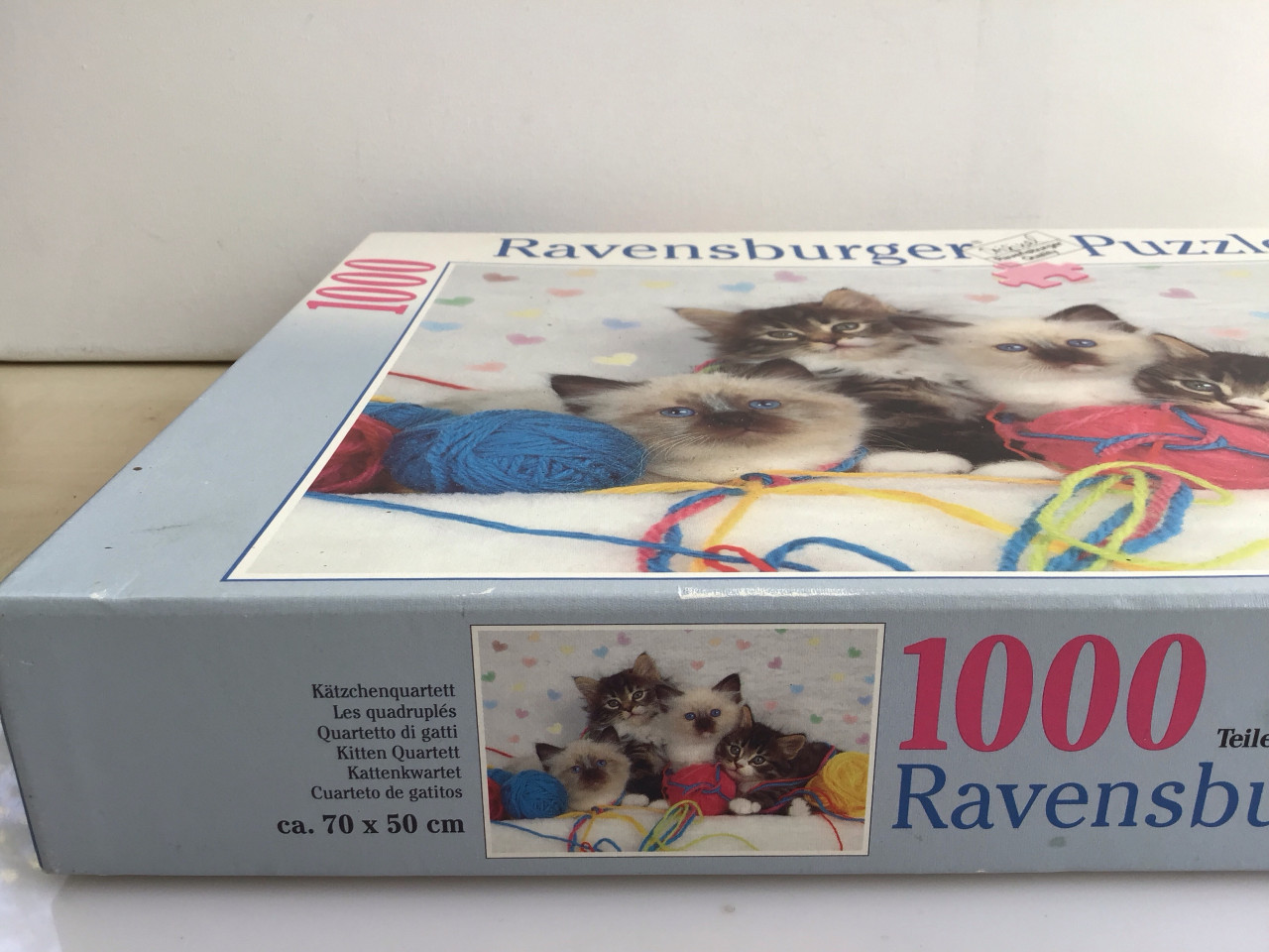Puzzel 4 kittens met bolletjes wol