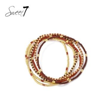 Armband trendy kralenmix in bruin, terracotta en goudkleur
