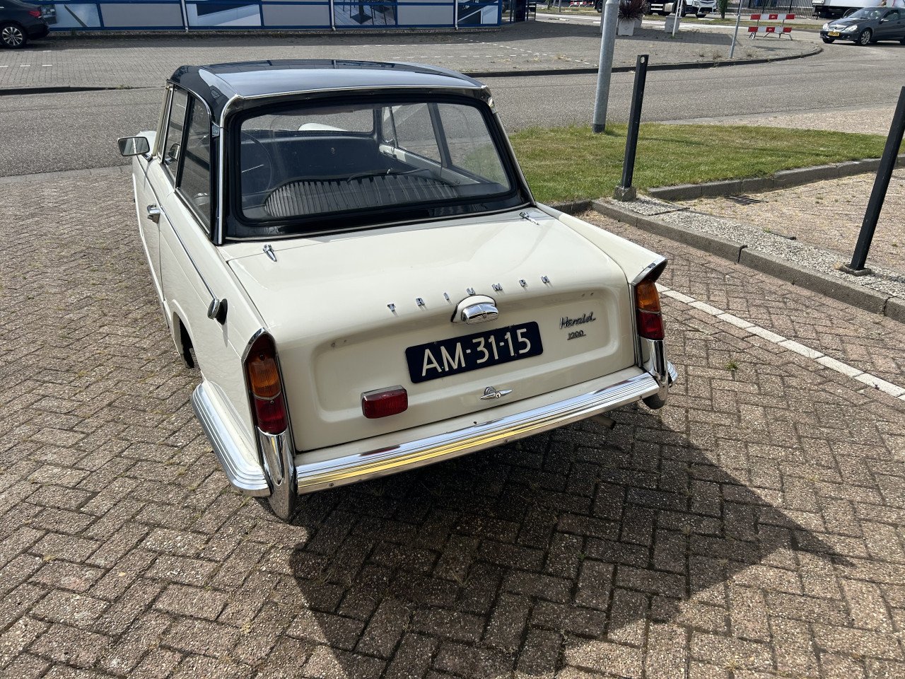 Triumph Herald 1965 en TR6 1973