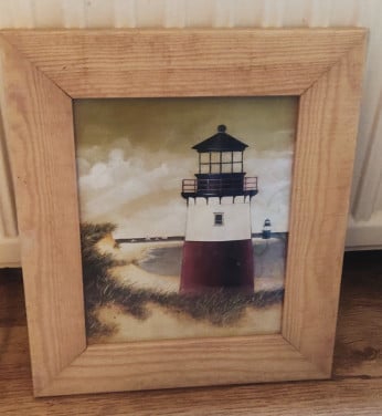 Vuurtoren foto in een houten lijst