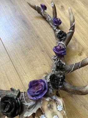 Wanddecoratie gewei met bloemen