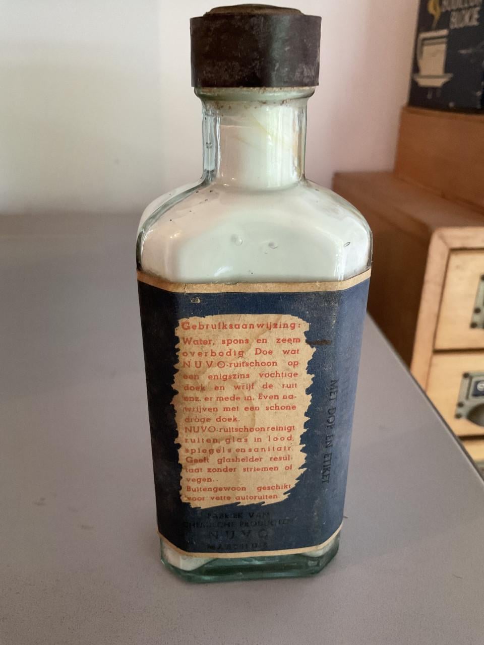 Oud flesje Nuvo ruitschoon