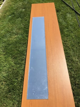 Houten plank en passpiegel