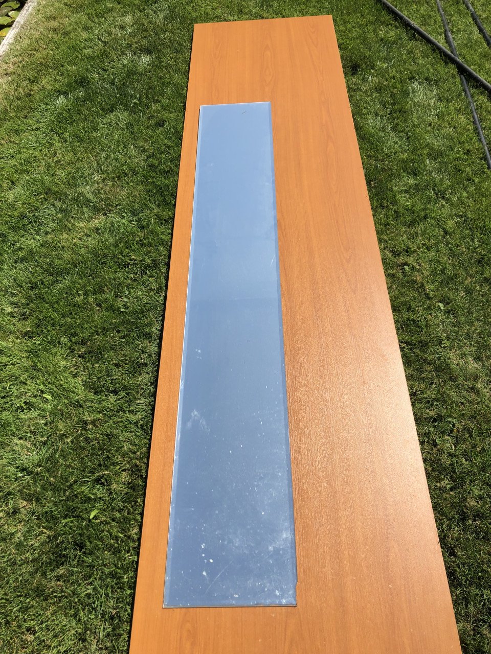 Houten plank en passpiegel
