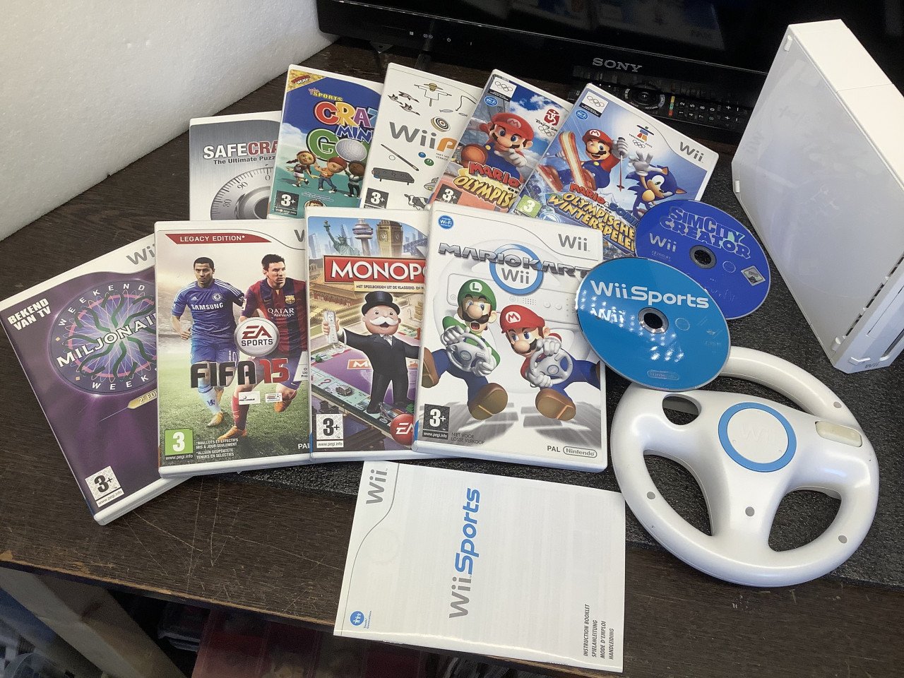 Nintendo Wii console met spellen en toebehoren. + Wii Fit balanceboard.