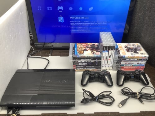 PlayStation 3 slim met 2 controllers en veel spellen.