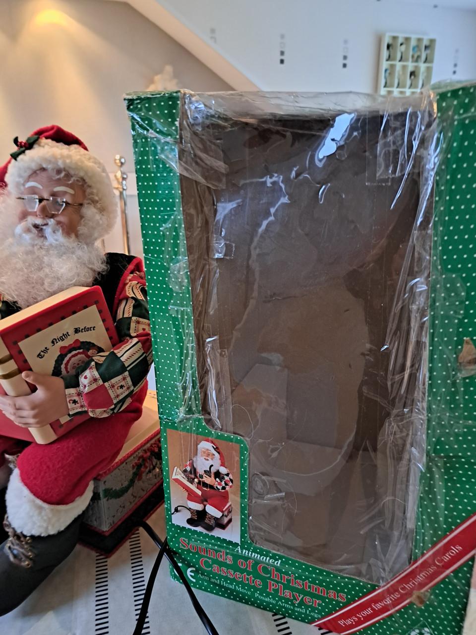 Bewegende kerstman die verhaal verteld