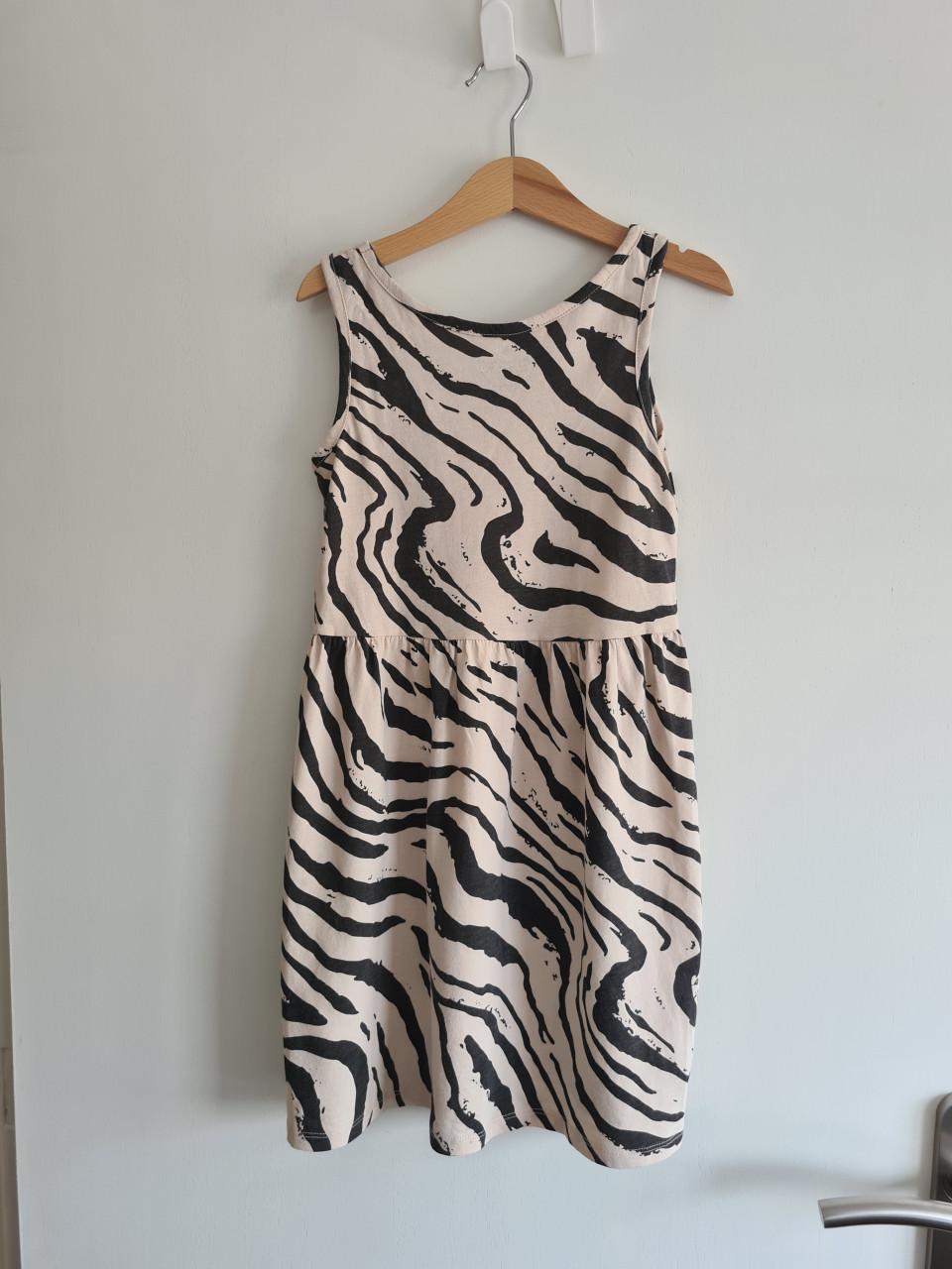 Ecru, beige met zwarte dierenprint jurkje van H&M  Maat 122-128