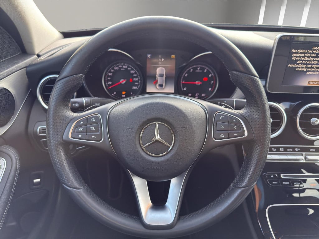 Mercedes-Benz C-Klasse c 180 business solution auto | navigatie | half lede