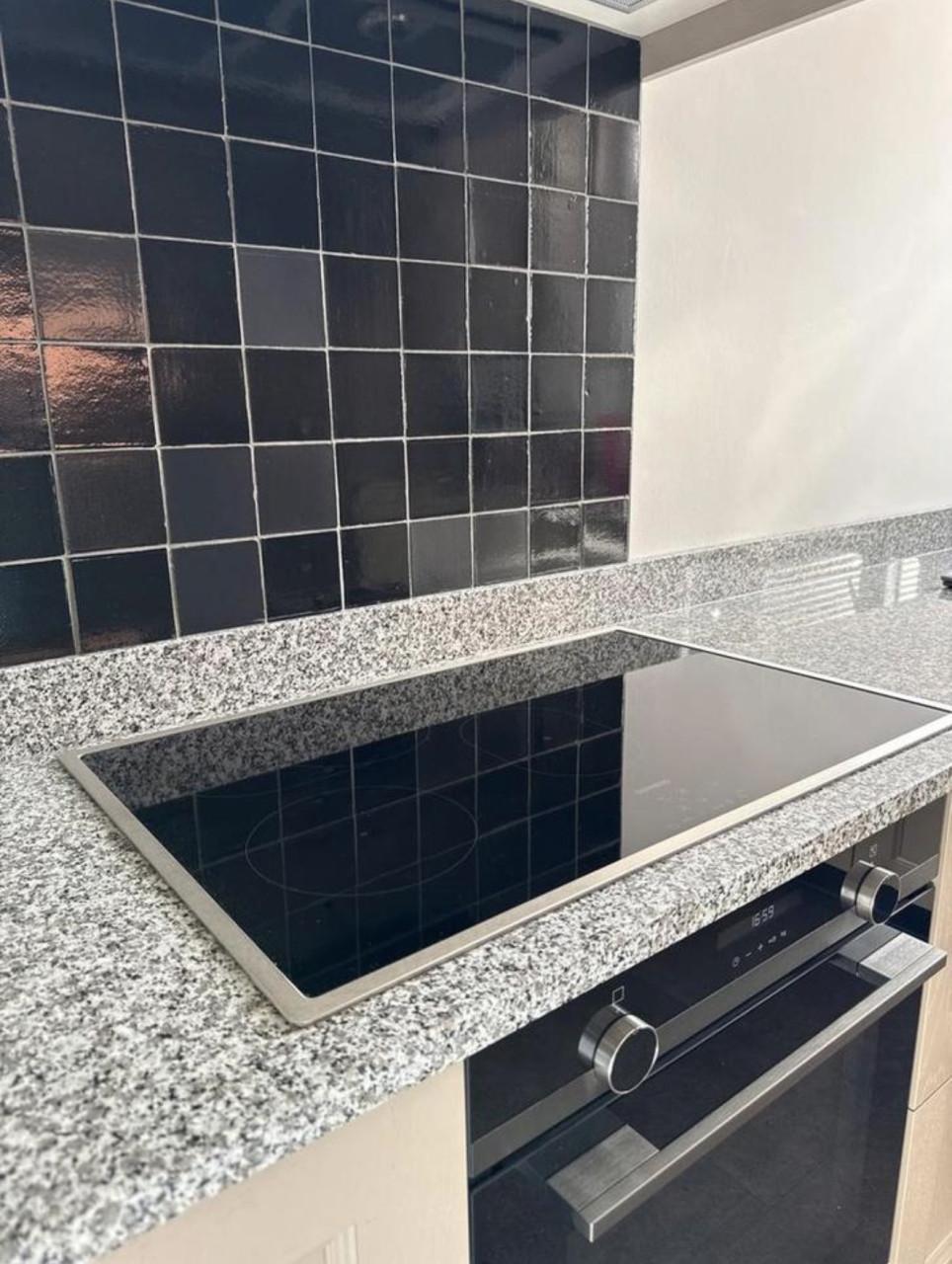 Complete hoekkeuken met Quooker, Siemens en Atag apparatuur