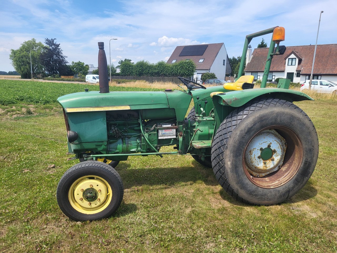 John Deere 310 met kenteken