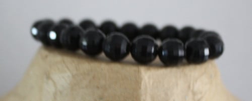 Zwarte glitter  armband met kralen rekbaar