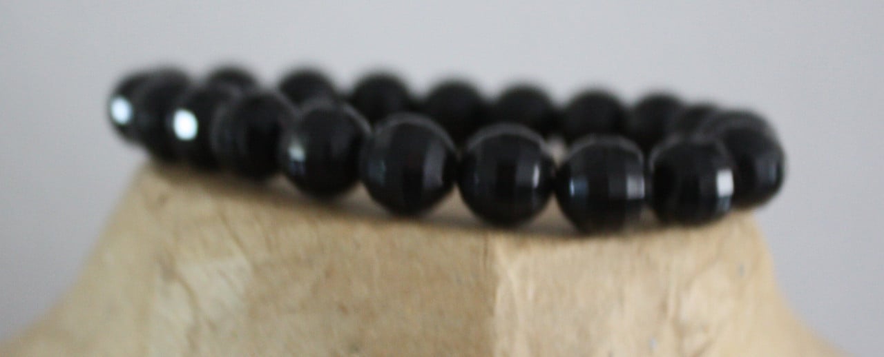 Zwarte glitter  armband met kralen rekbaar