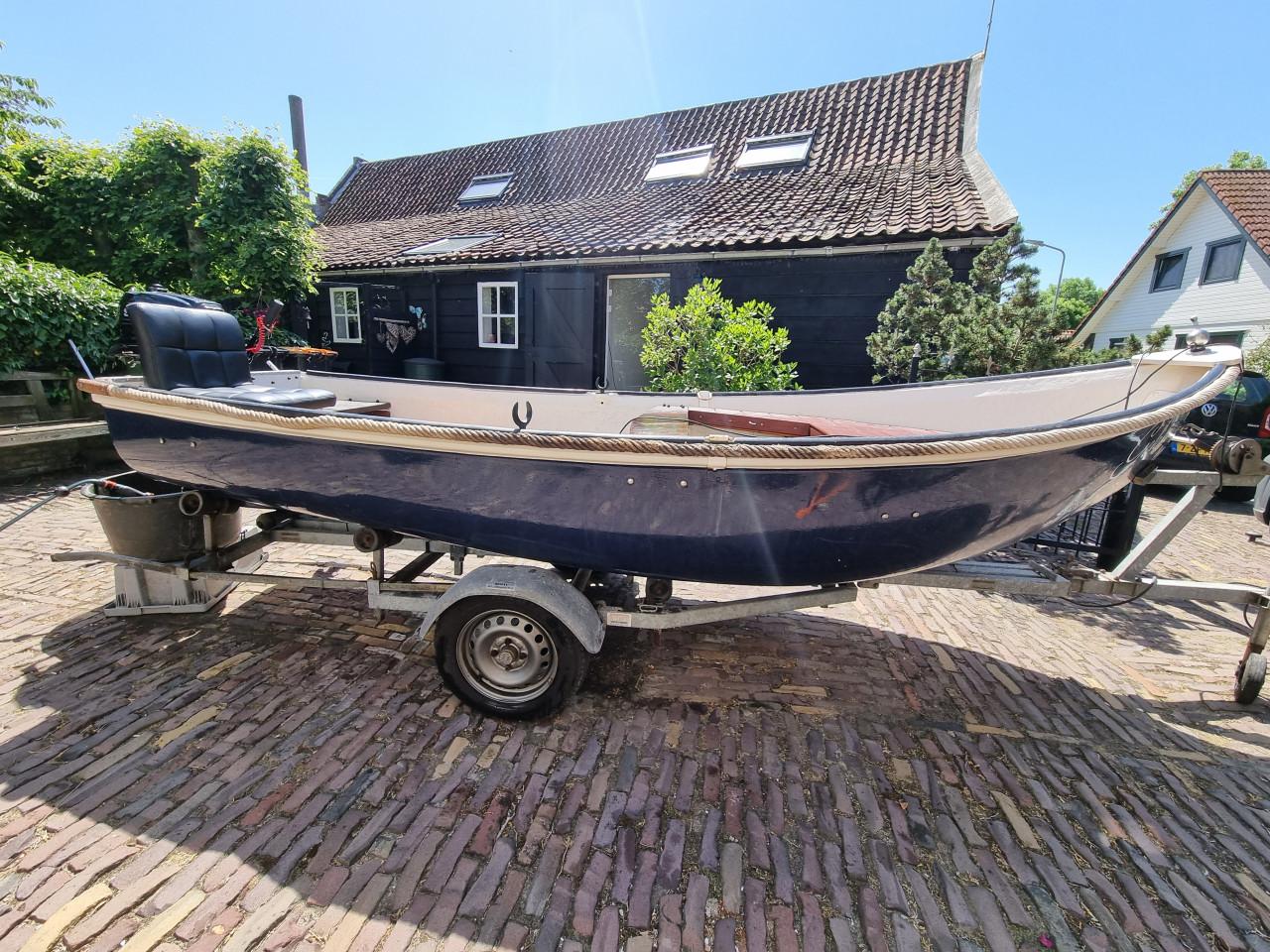 Sloep met 6pk suzuki