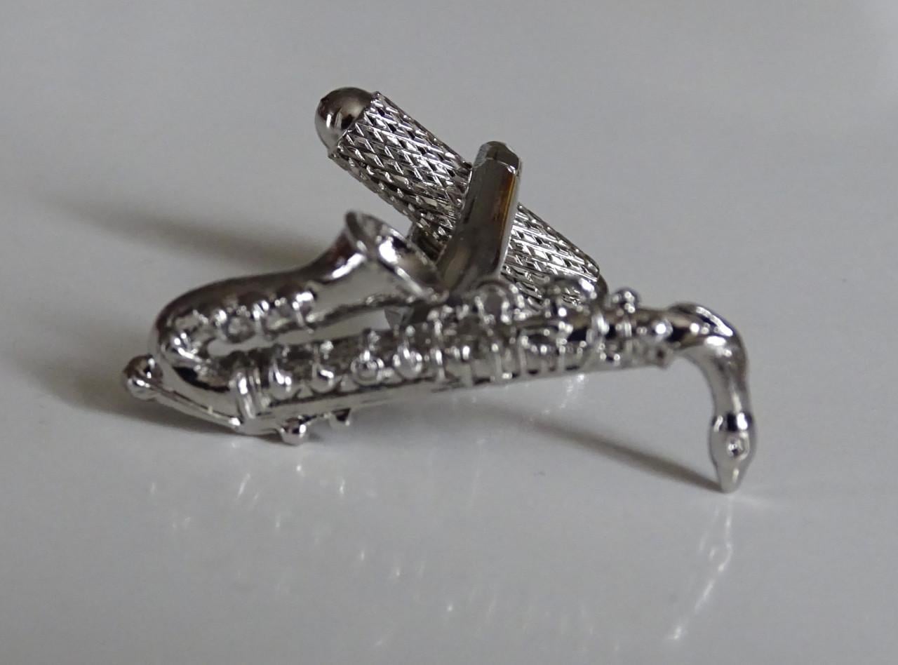 Saxofoon speldjes en manchetknoop