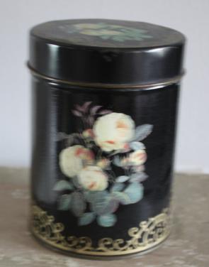 Mooi zwart gebloemd rond blikje