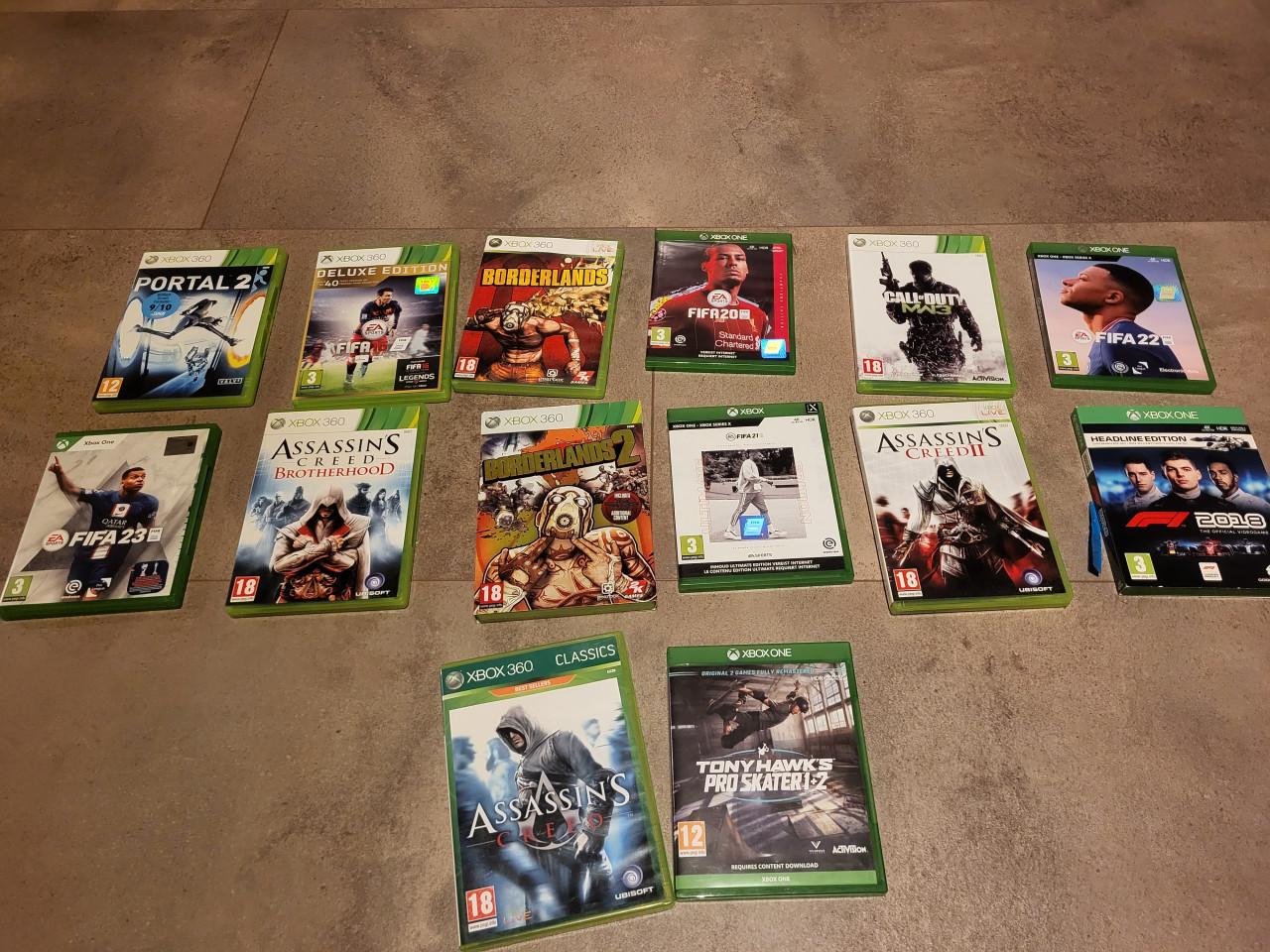Xbox One inclusief 14 spelletjes + 2 controllers