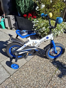 Politie fietsje met zij wieltjes