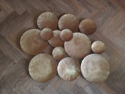 Metale wanddecoratie goudkleurig