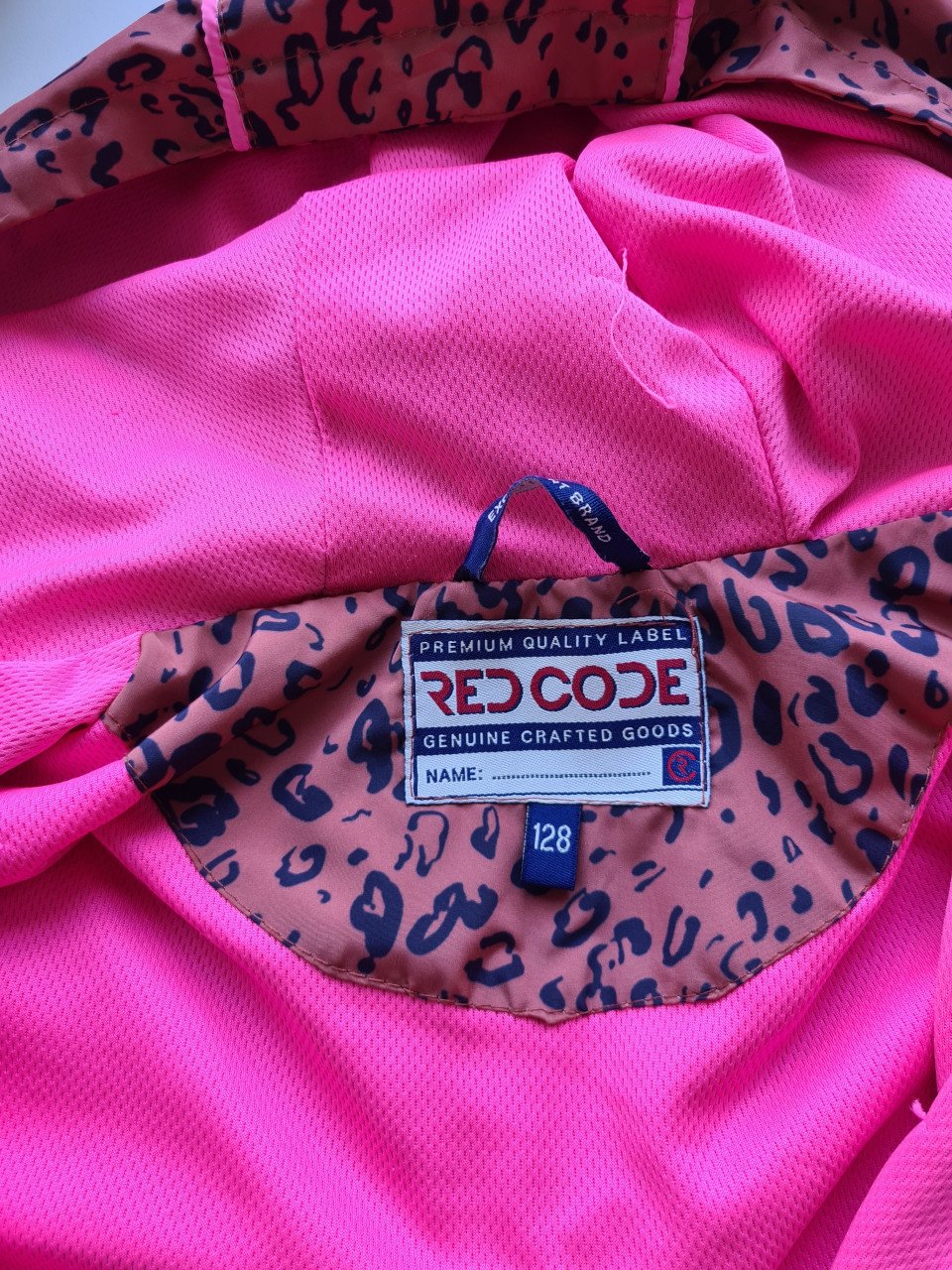 Roest bruin -zwart regenjack met capuchon van Red Code  Maat 128