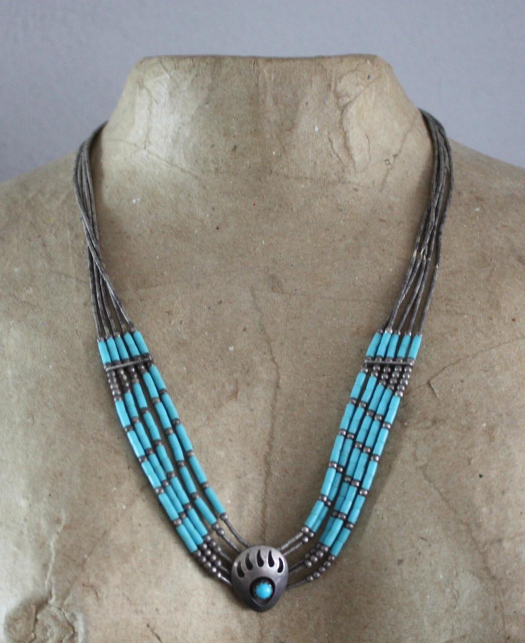 Zilverkleurige kettig met turqois kralen