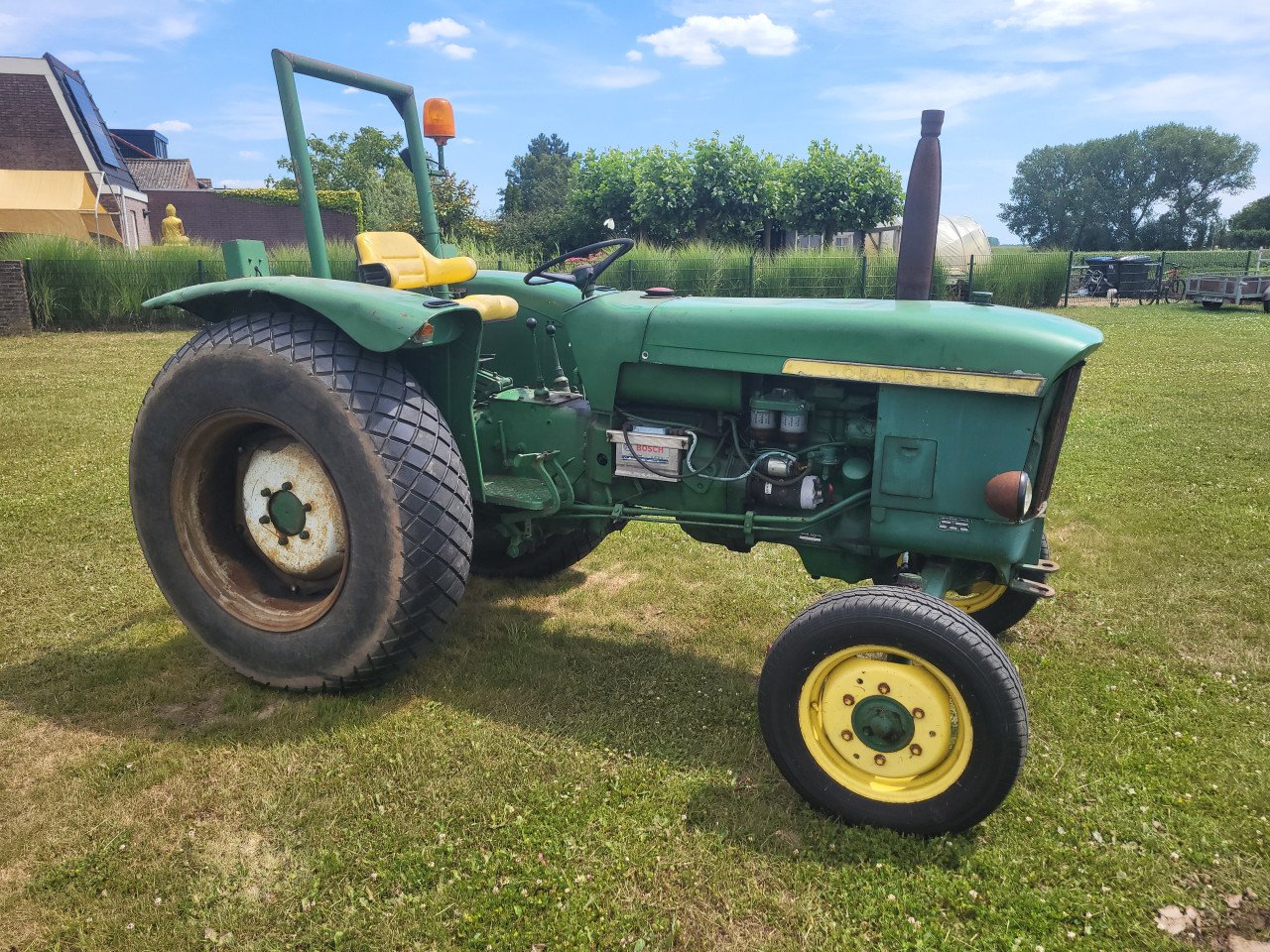 John Deere 310 met kenteken