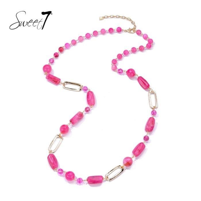 Halsketting met roze kralen en goudkleurige schakels