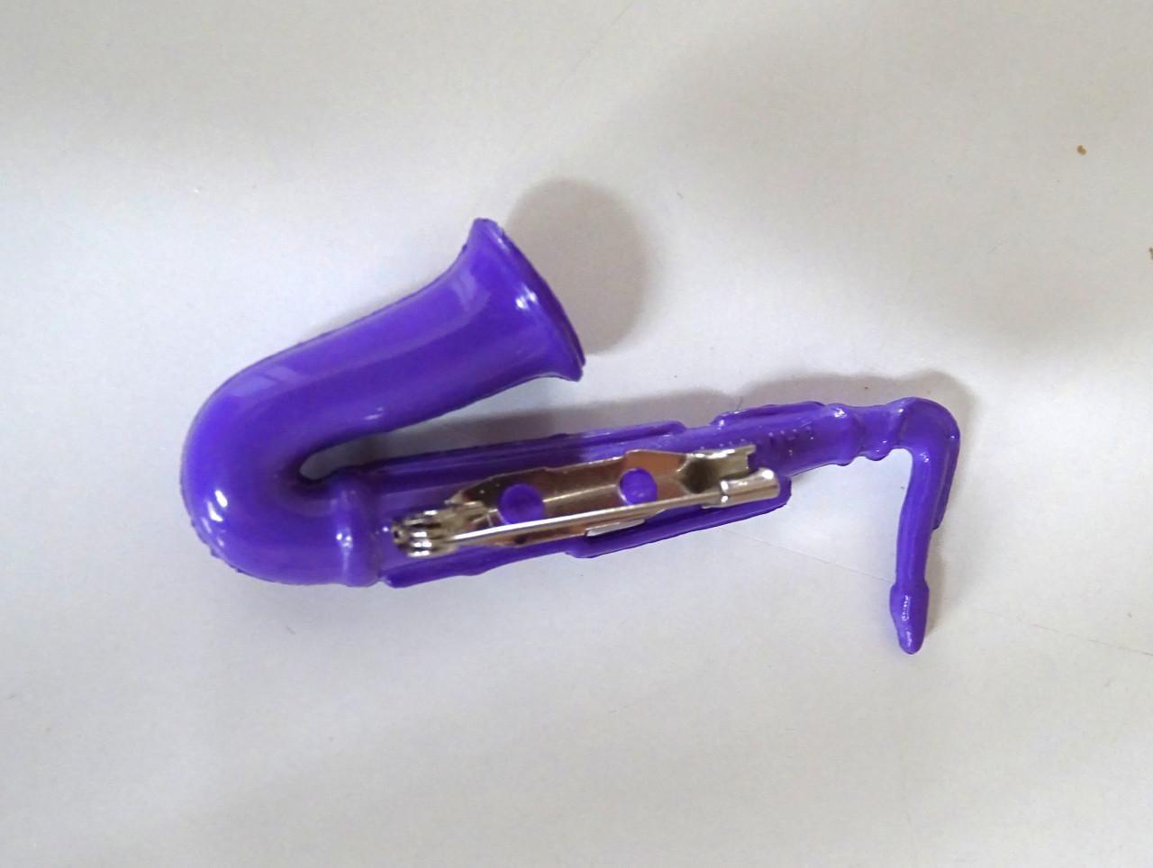 Saxofoon speldjes en manchetknoop