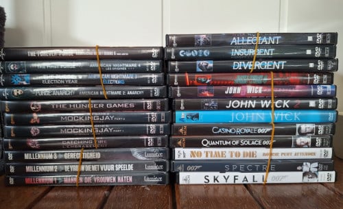 DVD-series The Purge, Divergent, Millenium, HungerGames, 007, John Wick.