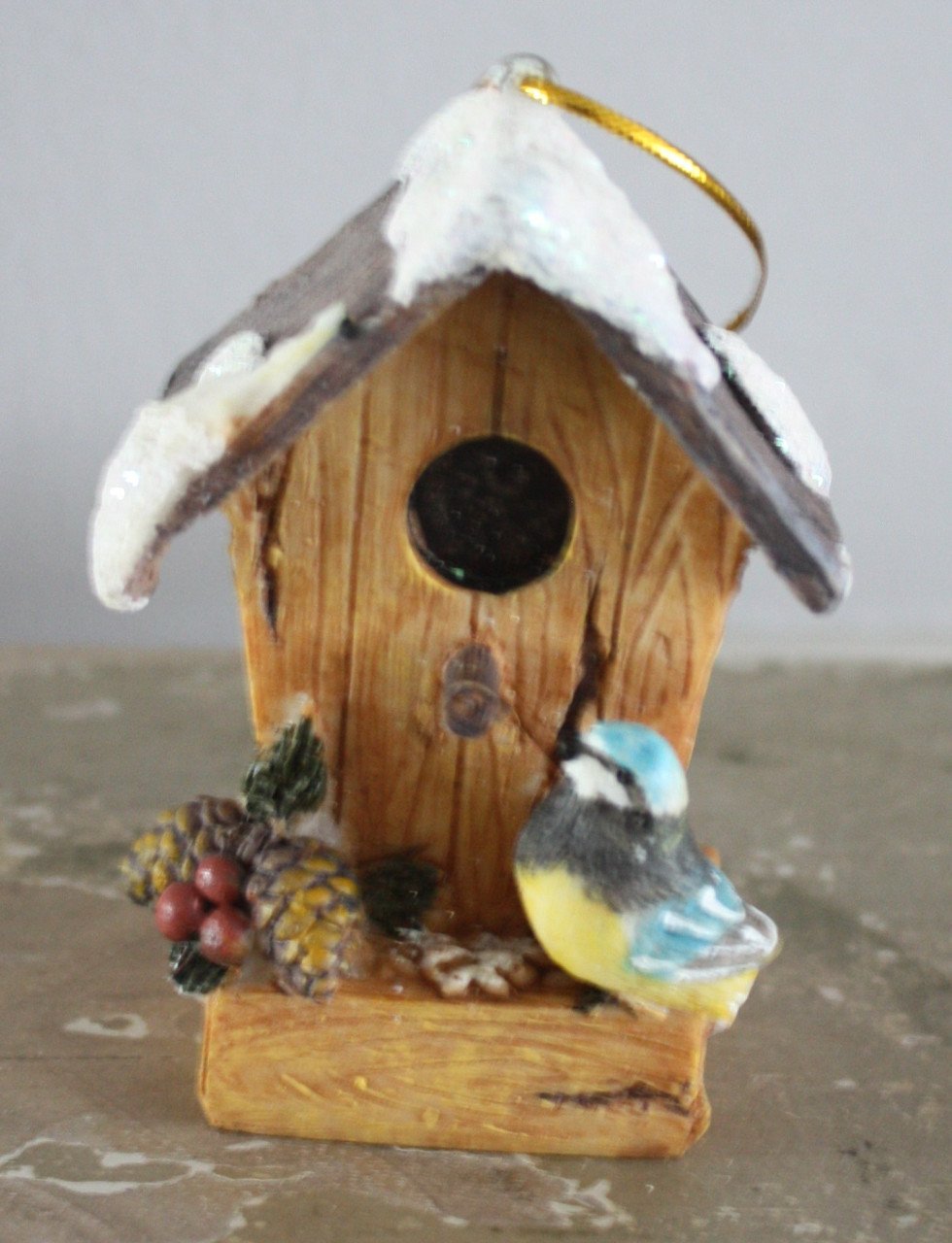 Stenen vogelhuisje hanger