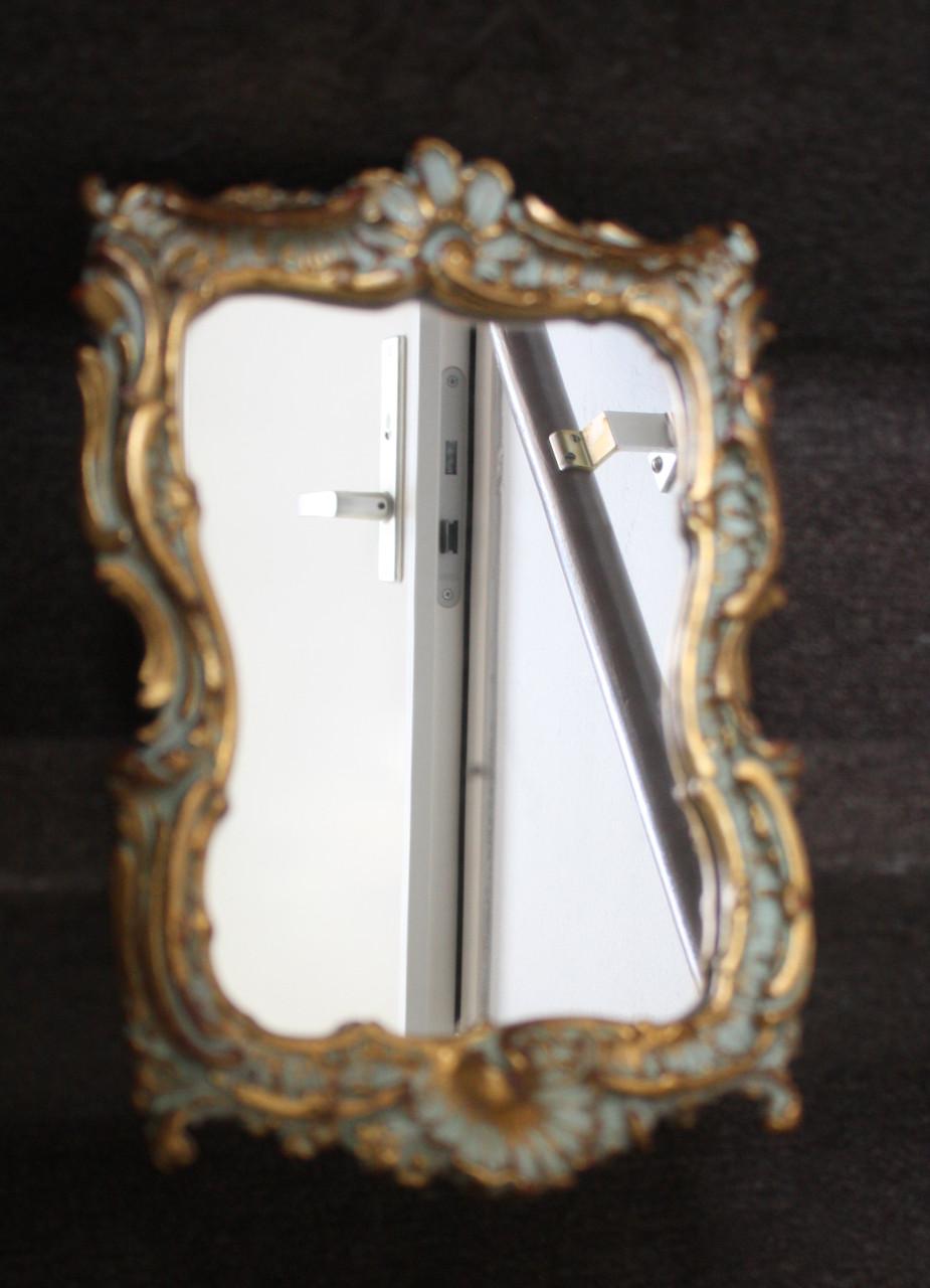 Goudkleurige spiegel barok lijst