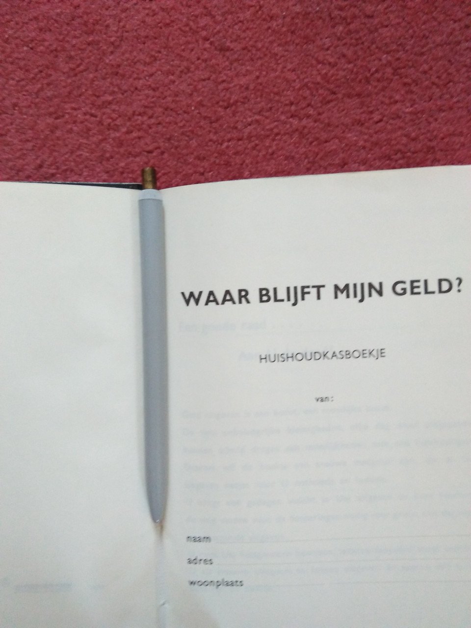 Kasboekje met pen